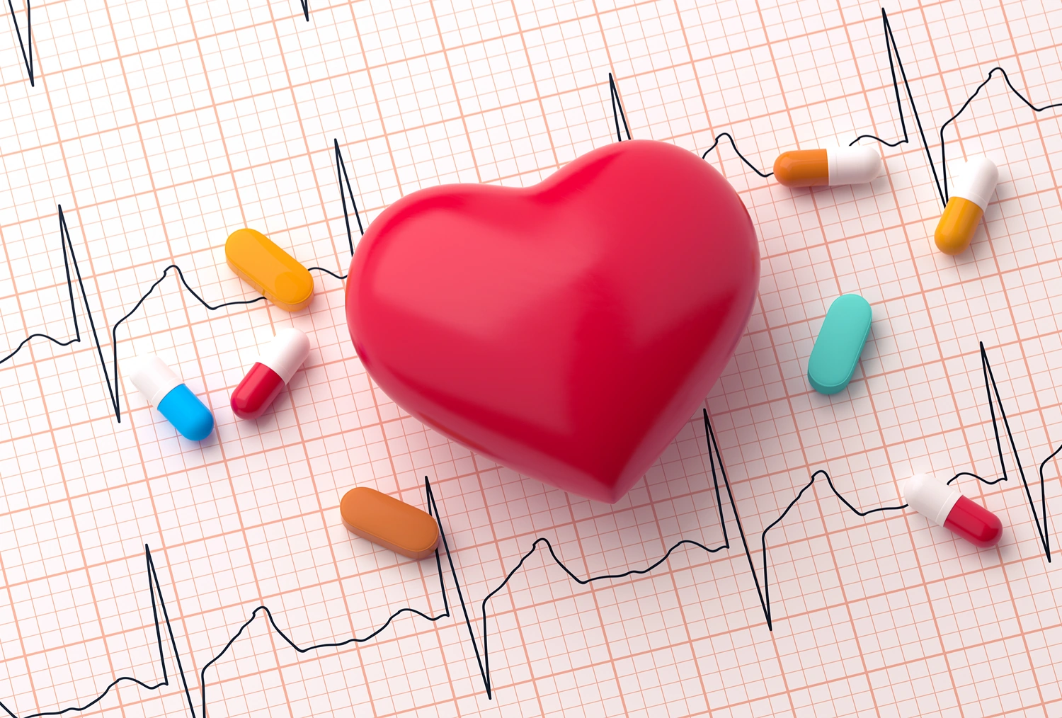 Heart model on EKG with scattered pills.